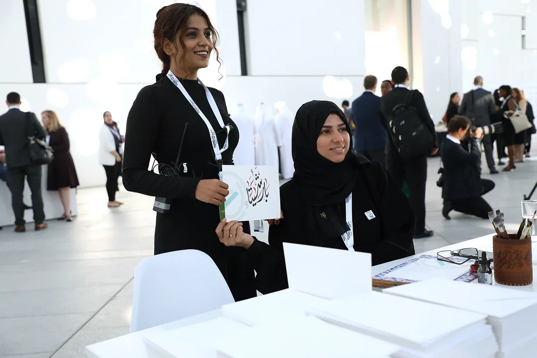 Registration counters fabricated to match the forum’s white scenic environment.