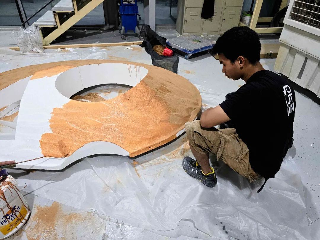 Lightweight composite and foam scenic forms being shaped and prepared for finishing.