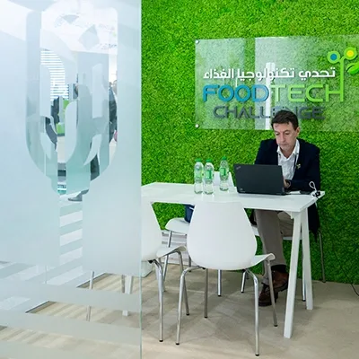 Custom scenic stage and exhibition fabrication delivered at ADNEC