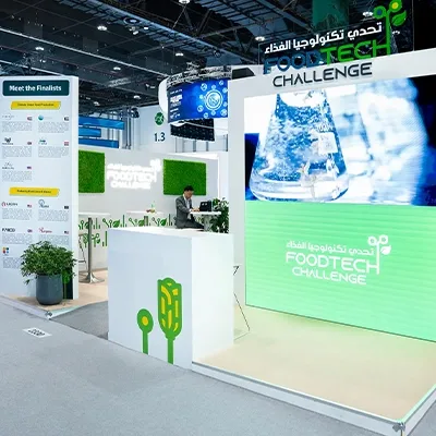 Themed scenic branding integrated into the FoodTech Challenge exhibition environment