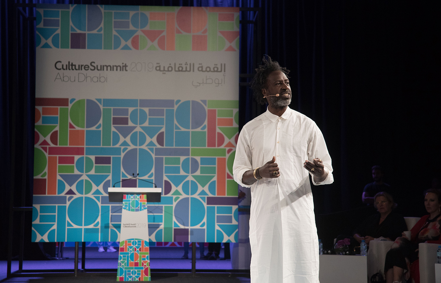 Custom Culture Summit signage positioned against the architecture of the Abu Dhabi venue.