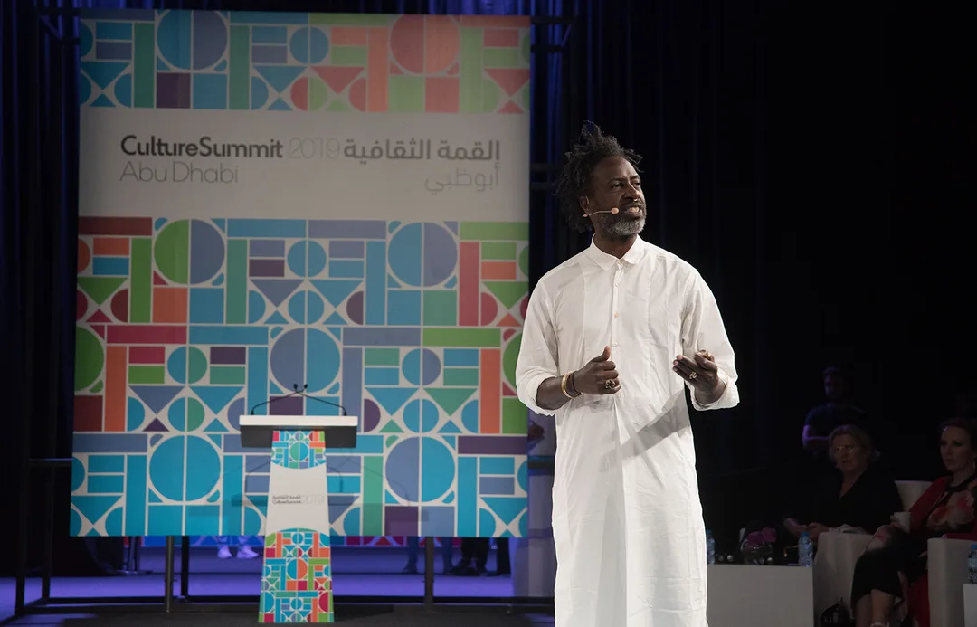 Custom Culture Summit signage positioned against the architecture of the Abu Dhabi venue.