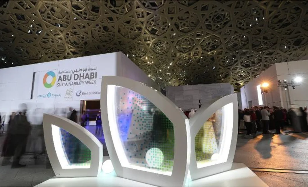 Evolution Scenic plywood leaf structures creating an illuminated reception environment in Abu Dhabi.