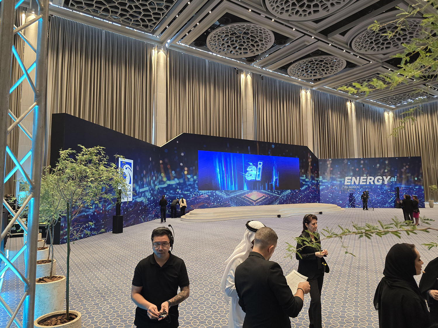 Branded scenic fabrication demonstrating integrated stage, graphics and technical equipment concealment.