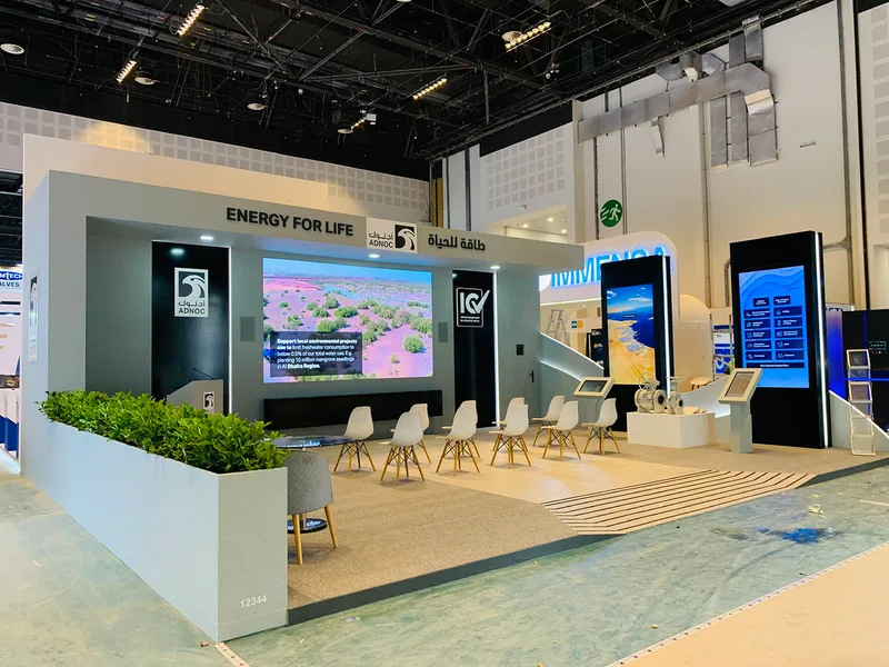 Evolution Scenic exhibition fabrication combining structural framing, MDF cladding, graphics and digital display