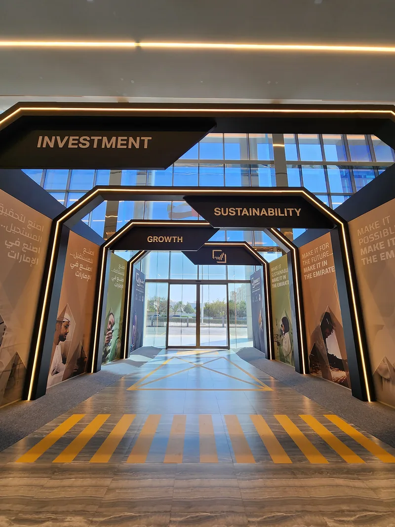 Evolution Scenic custom arrival arch with integrated dynamic content at Abu Dhabi Energy Centre.