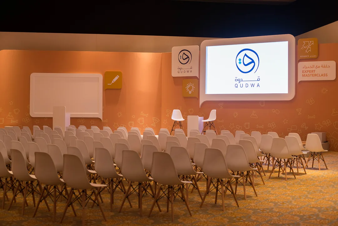 Six coordinated ballroom breakout stages with branded backdrops and screen surrounds.