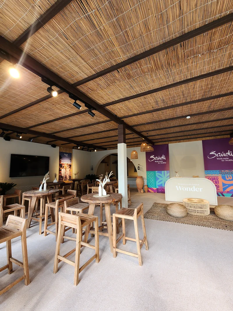 Evolution Scenic aluminium-framed ceiling finished with natural barasti timber poles.