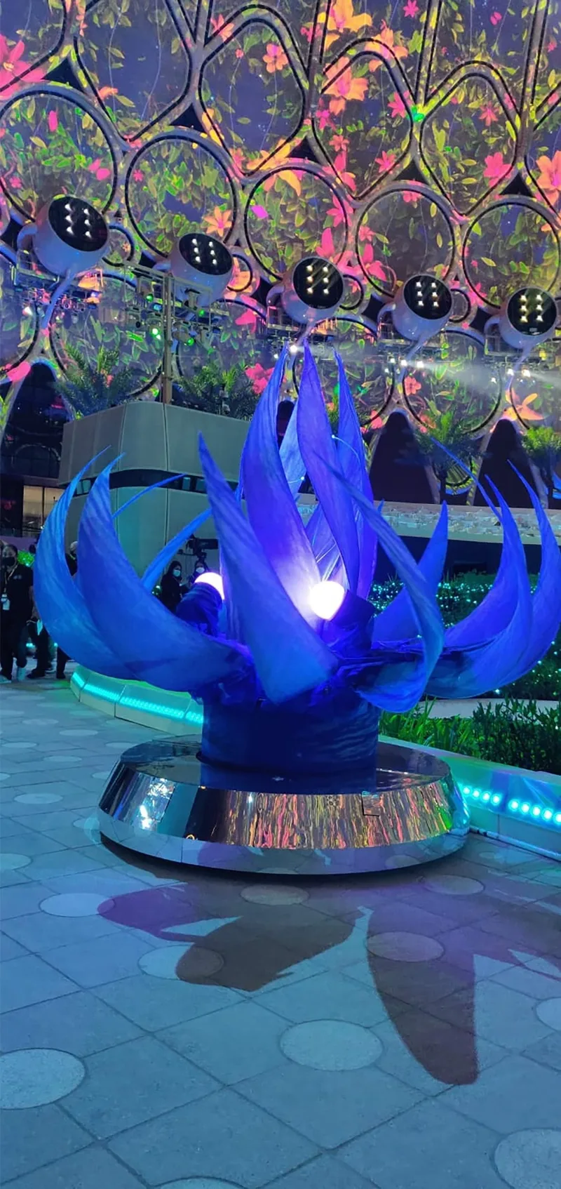Large scenic flower with internal LED illumination and textured translucent petal surfaces.