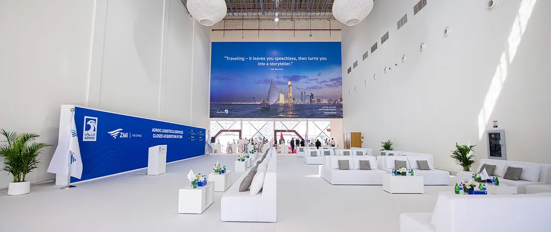 Evolution Scenic steel photo platform and branded scenic backdrops aboard Sentinel Barge in Abu Dhabi.