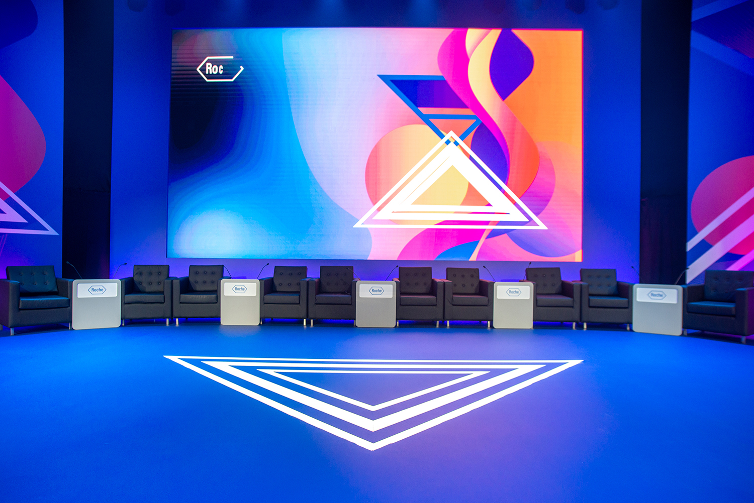 Evolution Scenic modular stage deck and painted scenic panels for Roche.