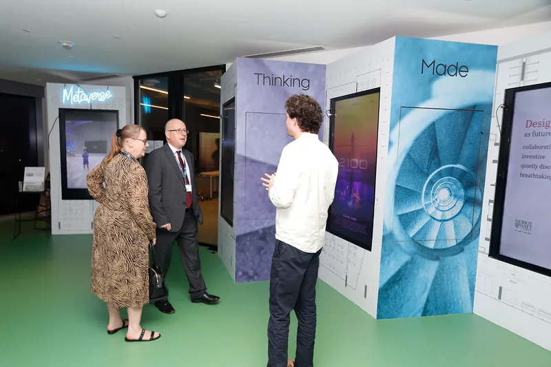 Self-standing exhibition walls with timber frames, MDF cladding and printed fabric finishes.