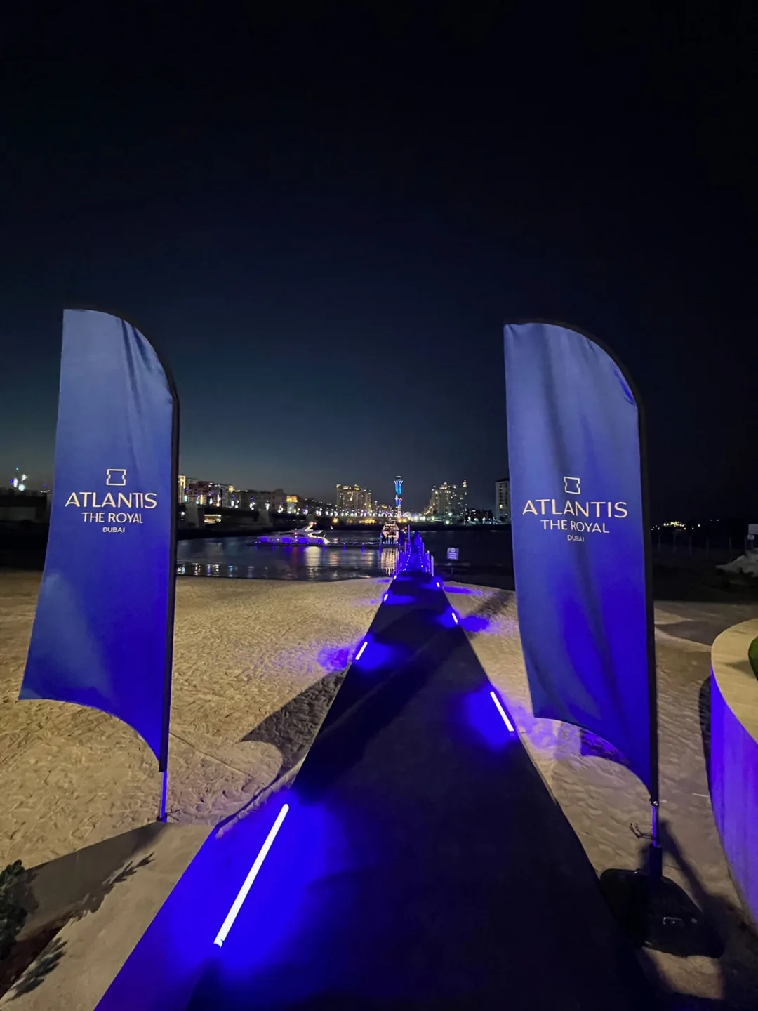 Branded fabric flags fabricated and installed throughout the outdoor scenic environment.