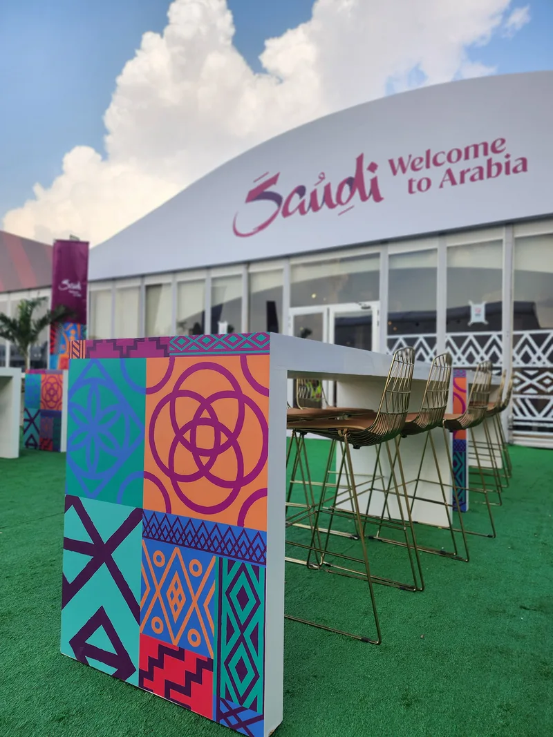 Branded Visit Saudi high table with Arrow barstools outside the Dubai 7s hospitality tent.