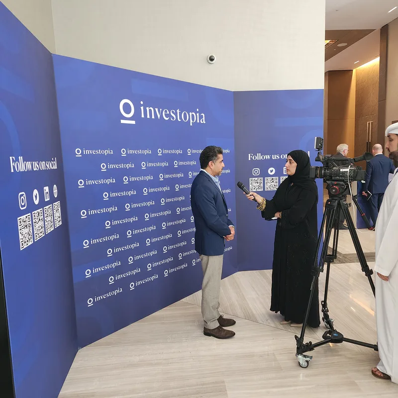 Custom branded scenic partitions organising meeting areas inside the Abu Dhabi Hilton.