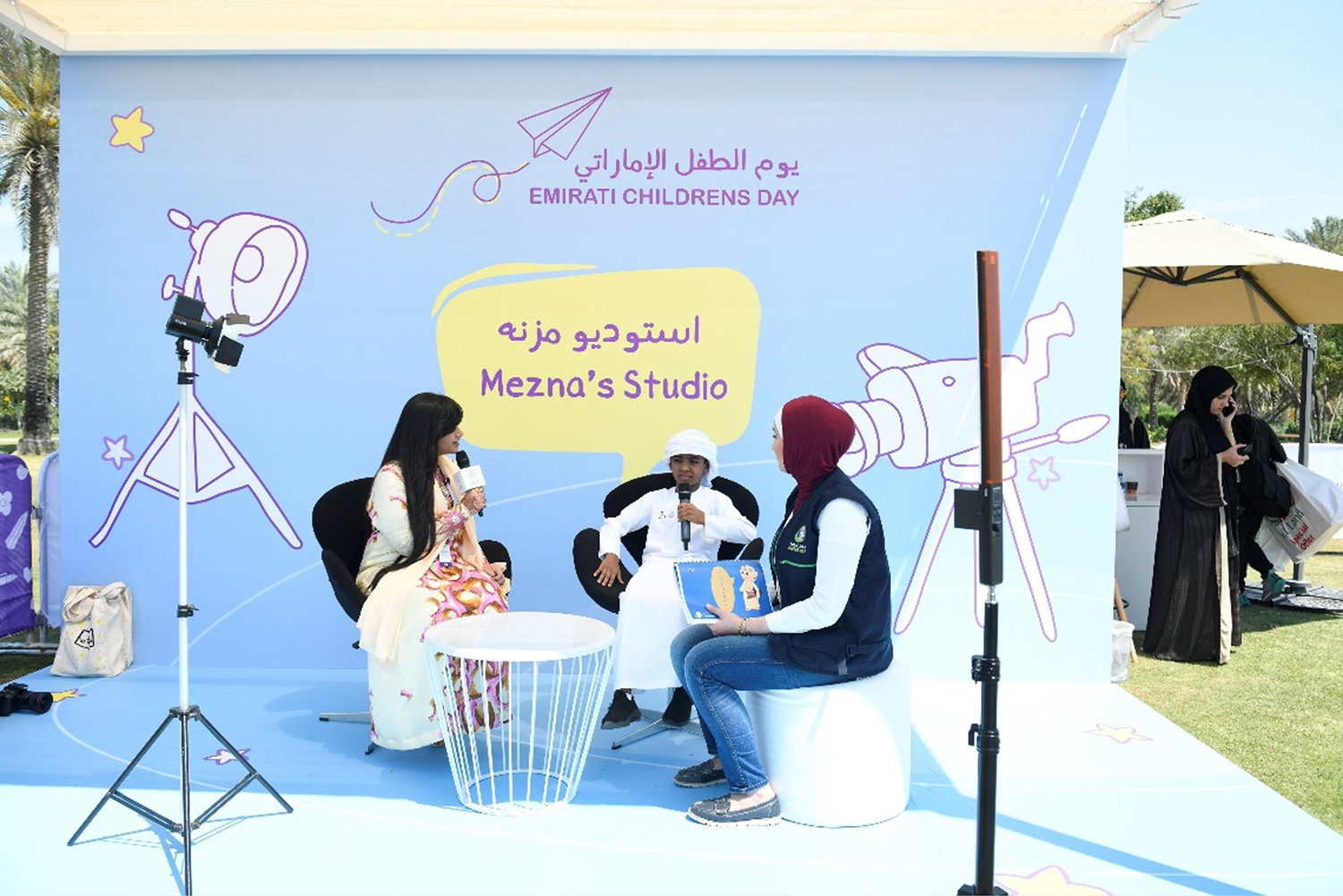 Evolution Scenic branded media backdrop created for outdoor interviews at Umm Al Emarat Park.
