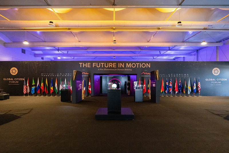Large branded perimeter wall fabricated for the Global Citizen Forum entrance area.
