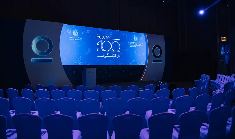 Evolution Scenic breakout stage with branded press conference backdrop and integrated LED screens.