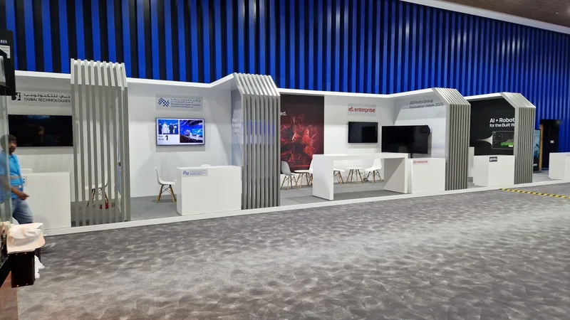 Custom plywood booth platforms finished with grey carpet throughout the innovation environment.