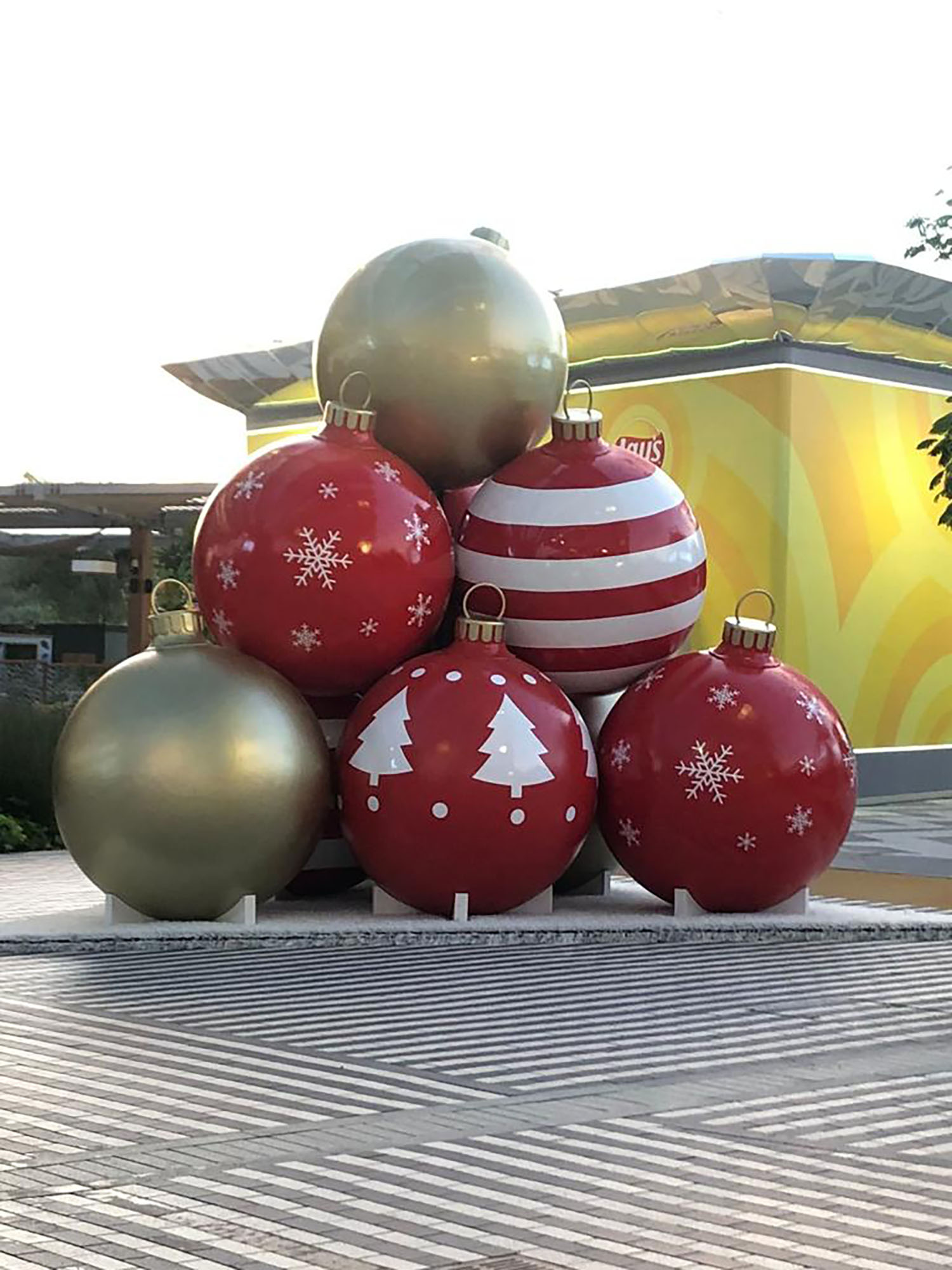 9.	Giant scenic bauble arrangement installed on a custom circular platform at Al Wasl Plaza.