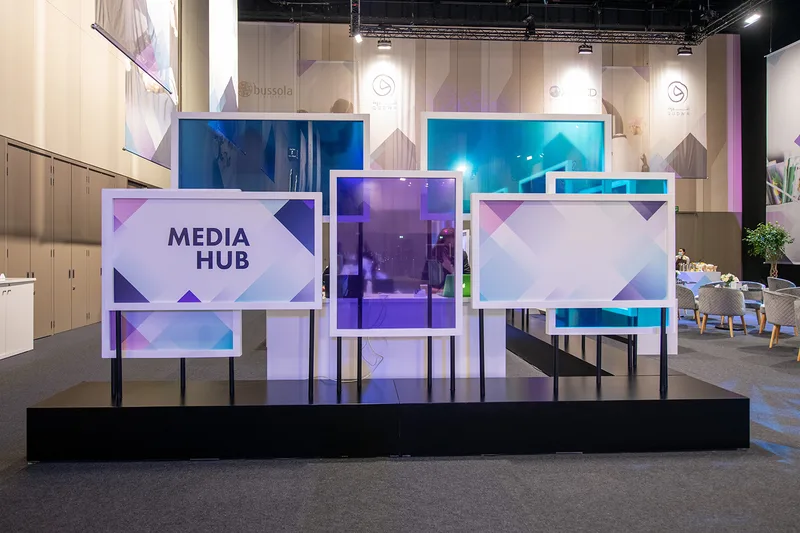 Coloured transparent panels forming the Qudwa–PISA Media Hub scenic installation.
