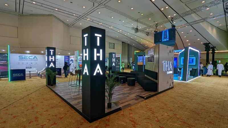 Compact exhibition environment combining scenic walls, concealed storage and integrated display screens.