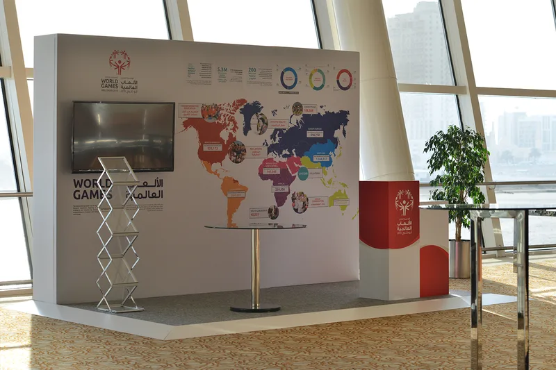 Graphic-clad scenic wall supporting branded content within the conference foyer.