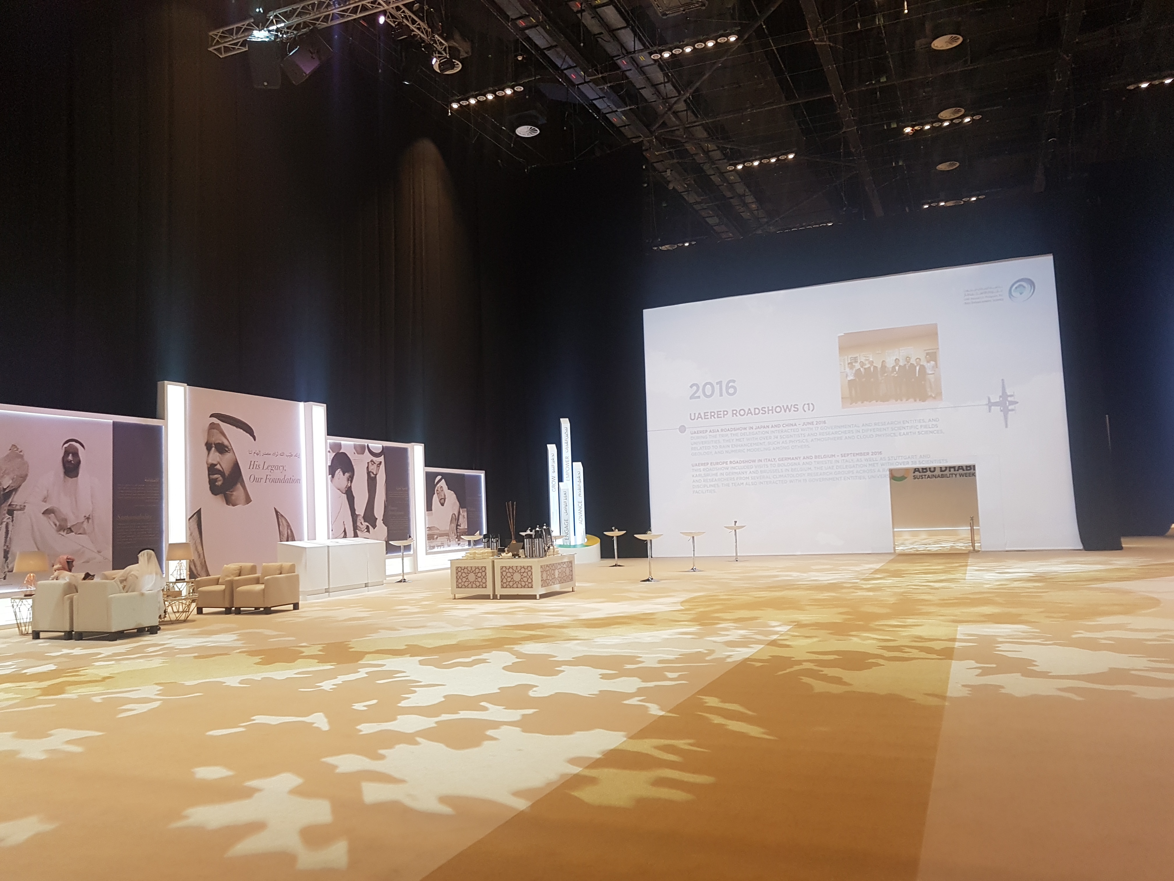 Evolution Scenic fabric partitions transforming a large exhibition hall with lightweight scenic structures.
