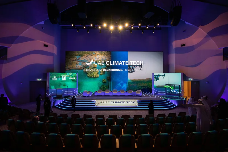 Evolution Scenic curved side screen structures with painted returns and integrated lighting.