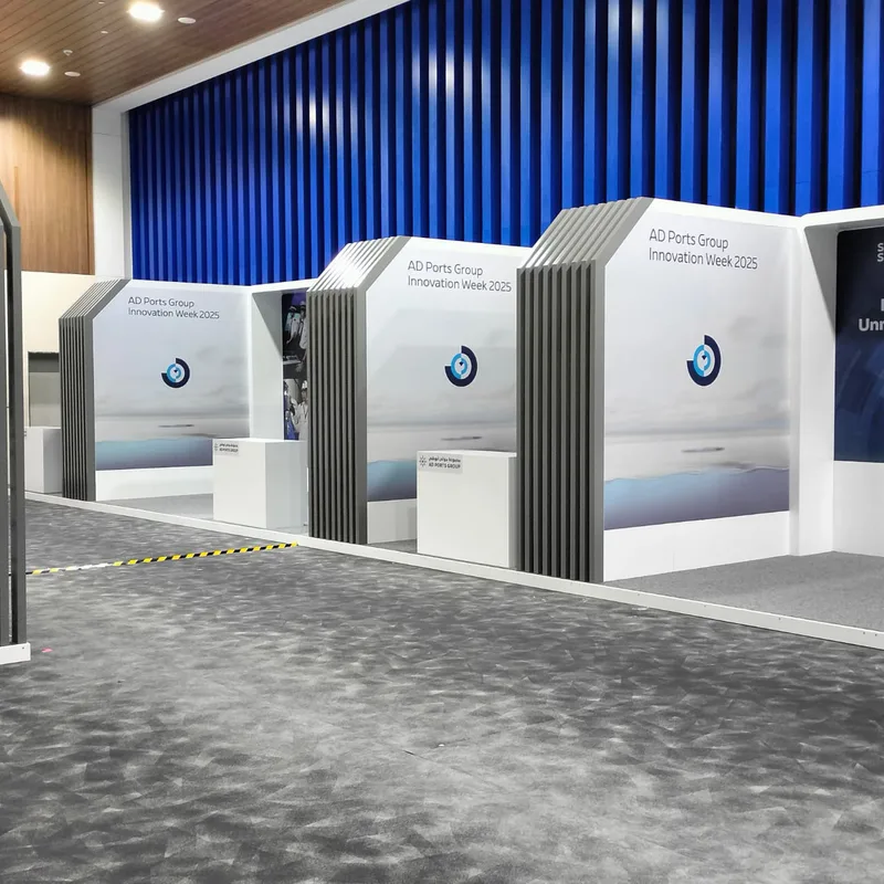 Evolution Scenic reception counter with concealed storage integrated into the exhibition booth frontage.