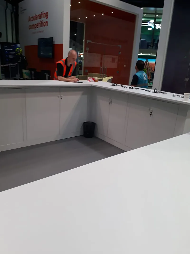 Custom exhibition counter and painted scenic walling forming the HPE GITEX stand environment.