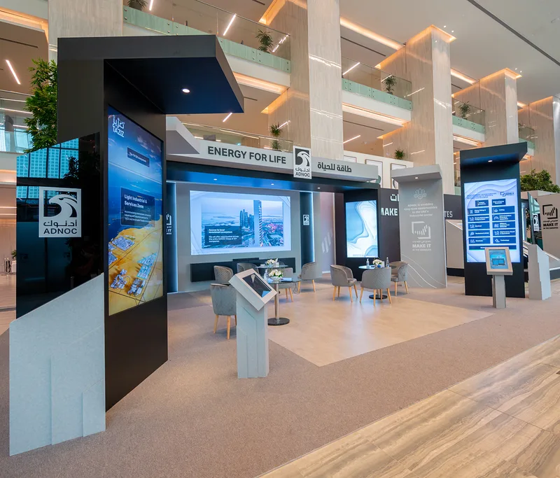 Evolution Scenic custom exhibition wall with recessed LED screen and branded fascia
