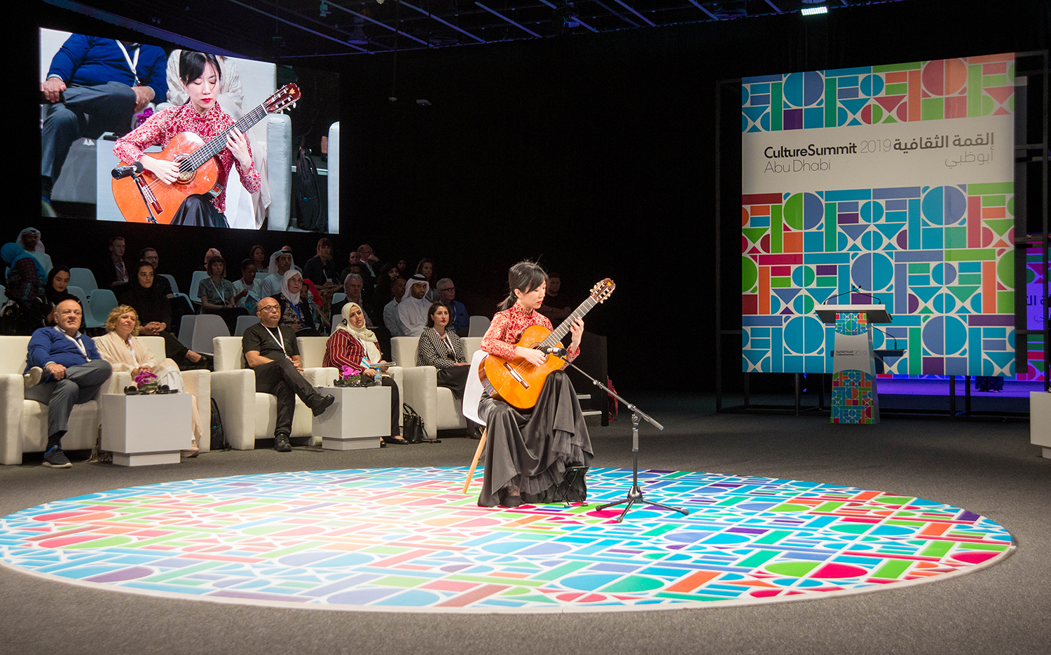 Culture Summit stage environment with custom furniture arranged around the central scenic floor.