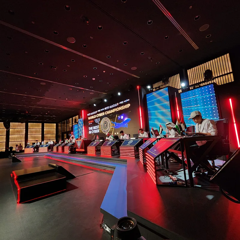 Custom scenic stage fabrication with integrated LED screens and branded MDF elements.