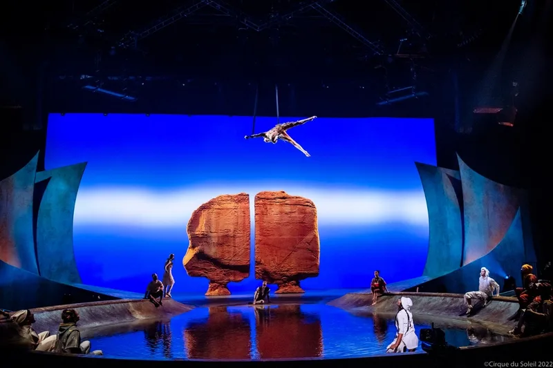 Monumental textured rock scenery divided through the centre for Cirque du Soleil.