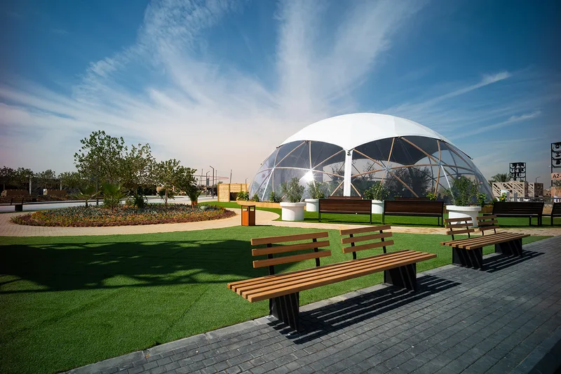 Evolution Scenic geodesic domes positioned within the landscaped Diriyah Oasis site.