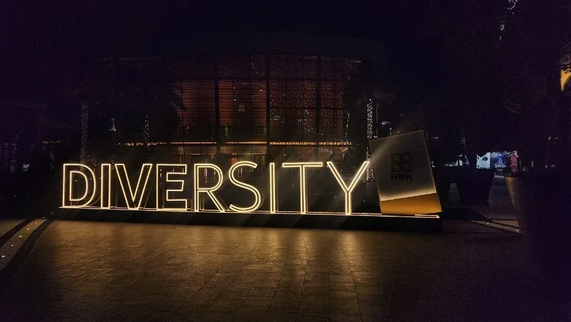 Custom exterior theme signage with rounded black frames and gold illuminated detailing