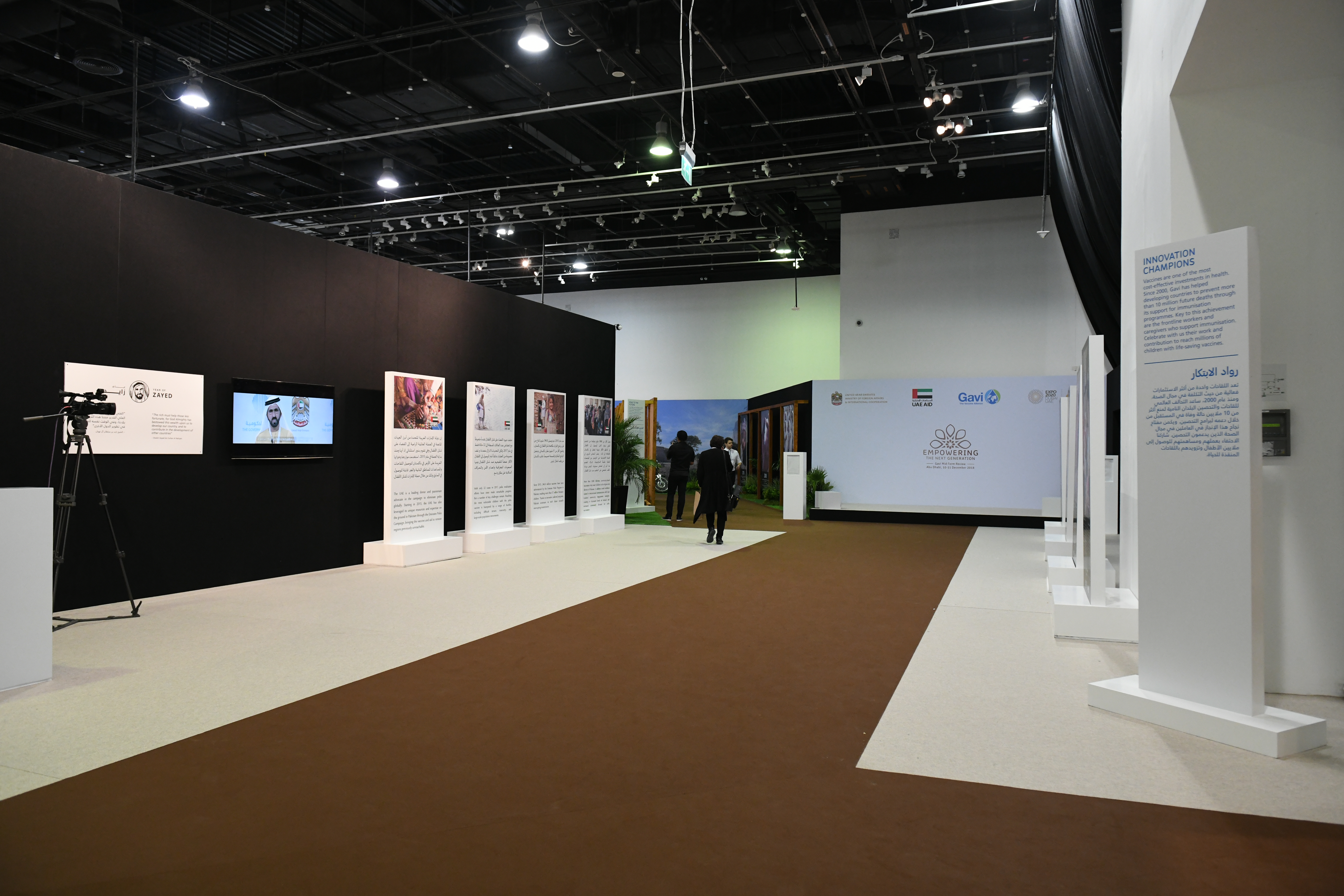 Pipe-and-drape, ceiling track and freestanding scenic fabric systems dividing a large venue.
