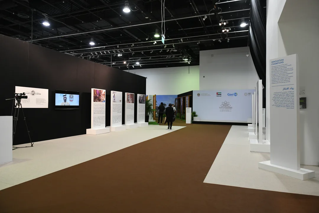 Pipe-and-drape, ceiling track and freestanding scenic fabric systems dividing a large venue.
