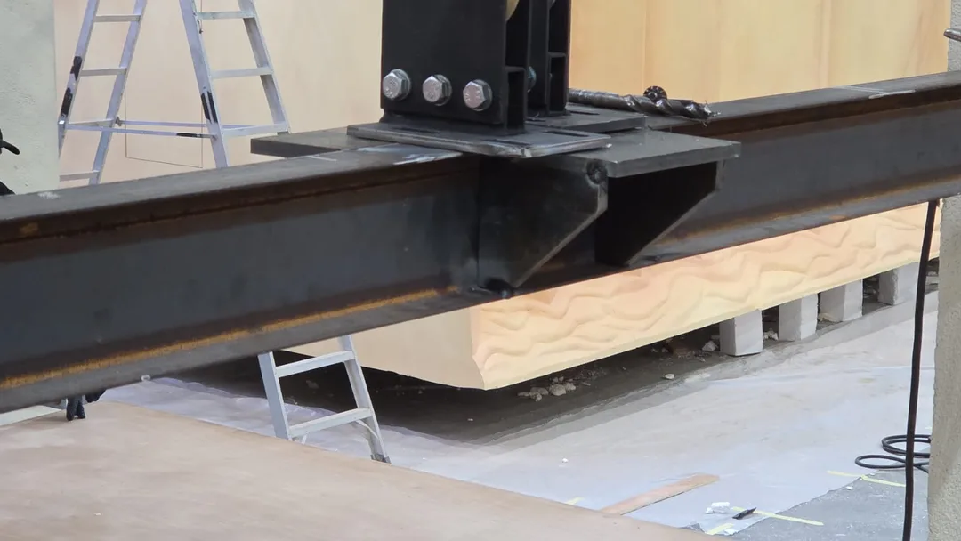 Engineered scenic steel connection with bracing, baseplates and bolted support details.