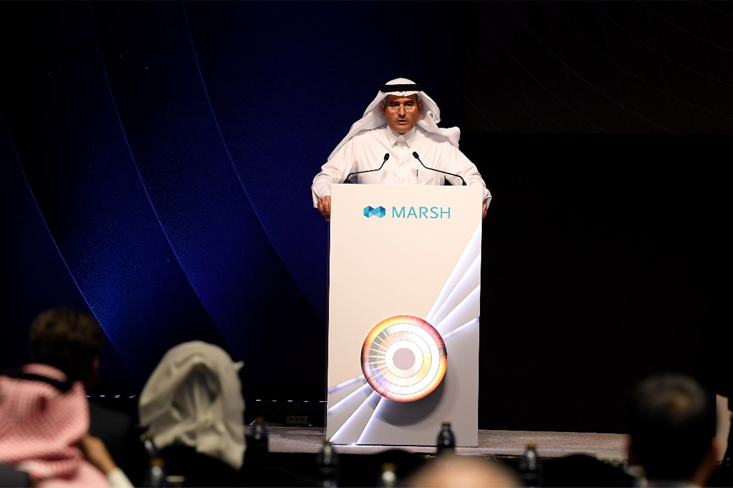 Branded lecterns positioned against the black scenic presentation backdrop at The Westin Dubai.