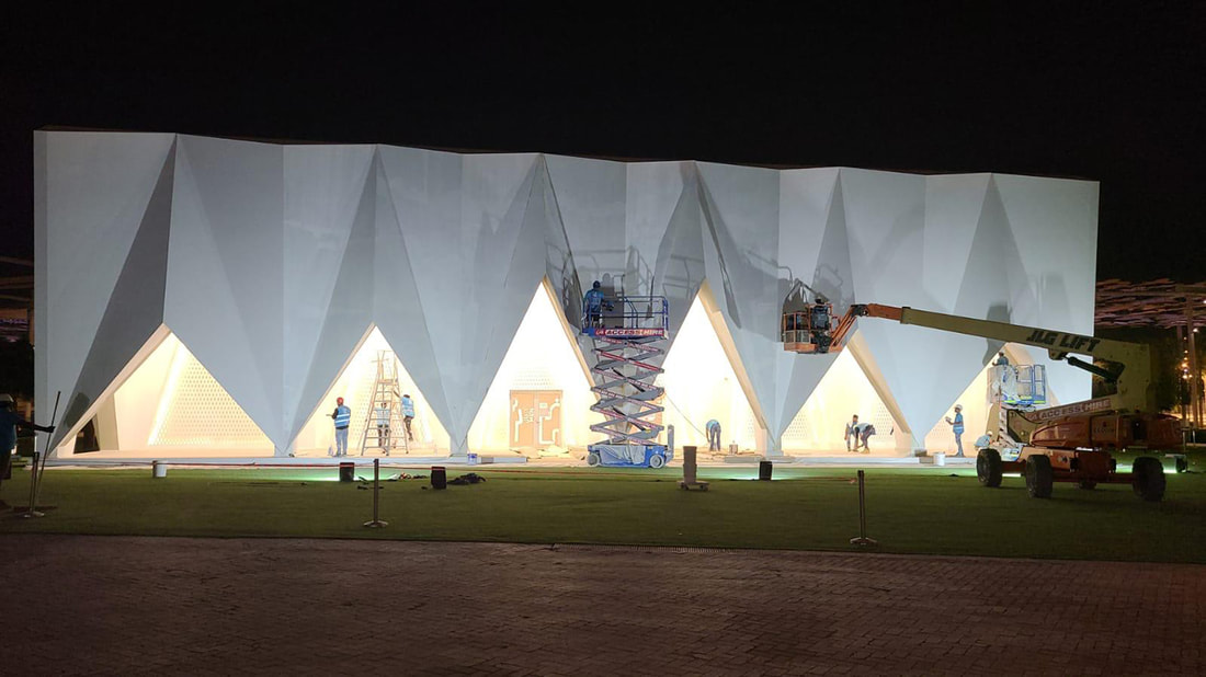 Evolution Scenic lattice and façade installation within the angular entrance portals. 