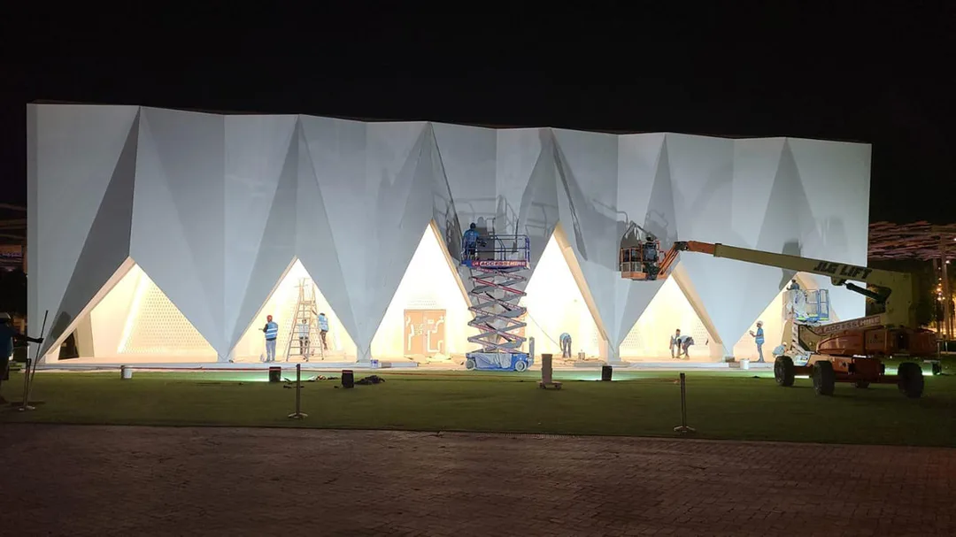 Evolution Scenic lattice and façade installation within the angular entrance portals. 