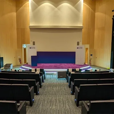 Timber-framed main stage backdrop with MDF cladding and printed fabric banner finish