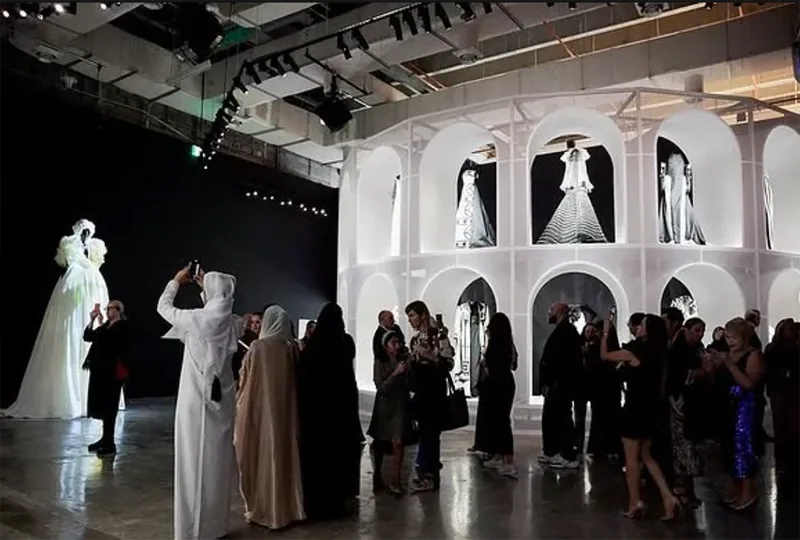 Bespoke gallery construction supporting luxury fashion exhibition displays.