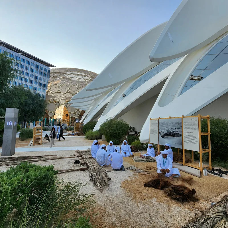 Temporary heritage exhibition structures integrated with the existing Expo City pavilion architecture.