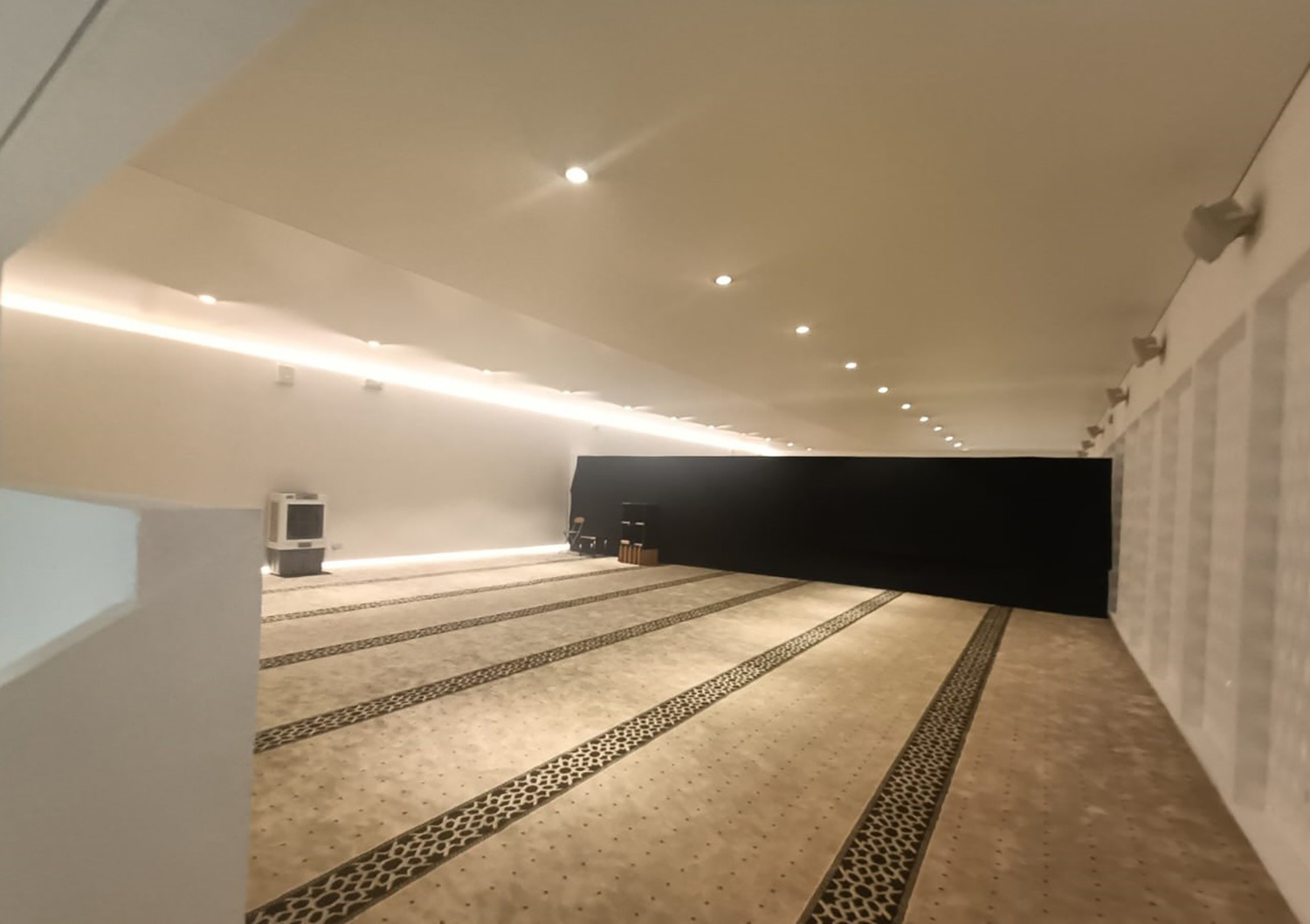 Patterned prayer carpet completing the main worship area at Expo City Dubai. 