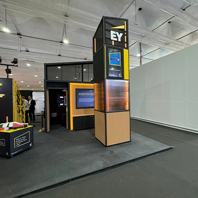 Integrated digital display recessed into the custom fabricated EY COP28 scenic wall structure in Dubai.