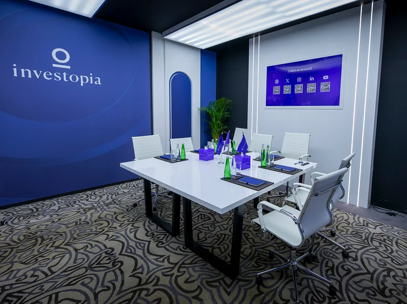 Evolution Scenic meeting room with fabric lightbox ceiling and integrated television backdrop.