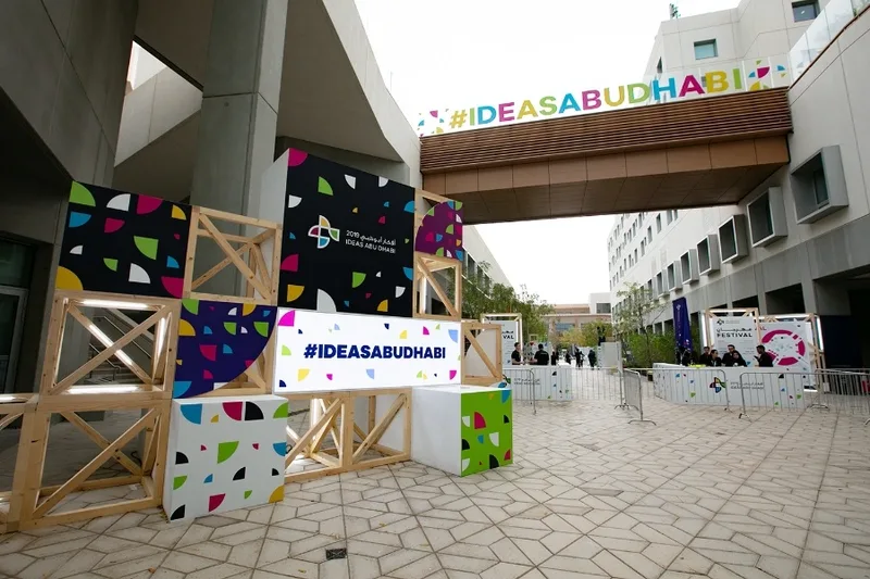 Large geometric entrance feature creating a temporary architectural threshold at NYU Abu Dhabi.
